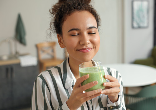 woman drinking smoothie