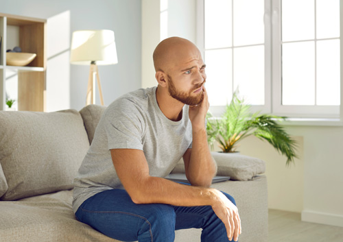 man suffering from toothache